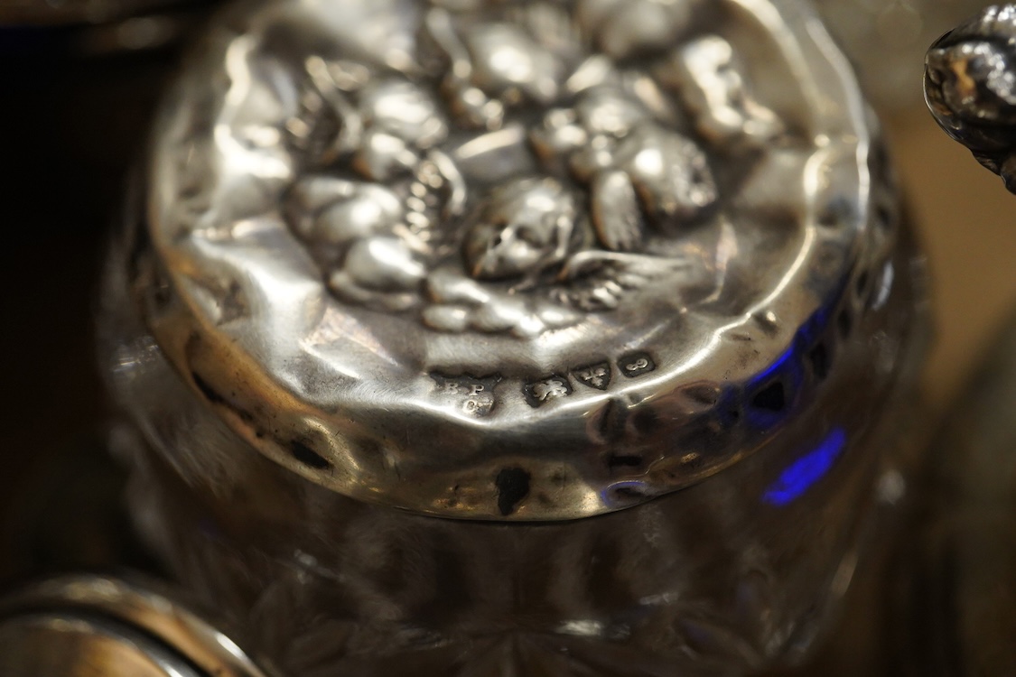 A George V pierced silver three piece condiment set, James Dixon & Sons, Sheffield, 1923/25, together with seven other assorted silver condiments, a silver mounted trinket box, a silver egg cup, a silver mounted glass sa